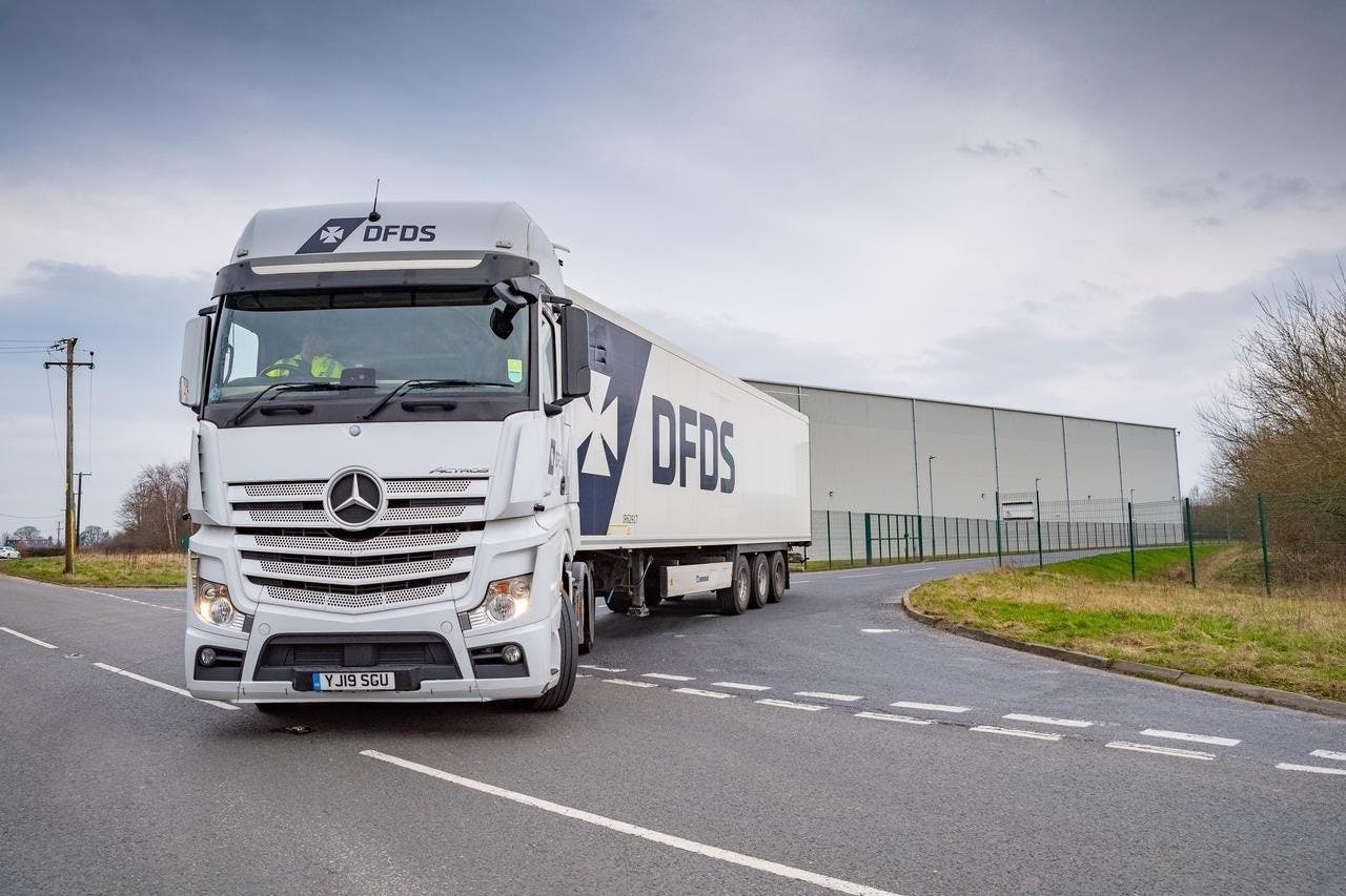 DFDS, white truck, cold chain, on road, driving