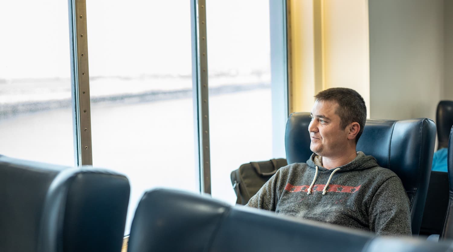 A DFDS Freight and Logistics driver sitting inside a vessel