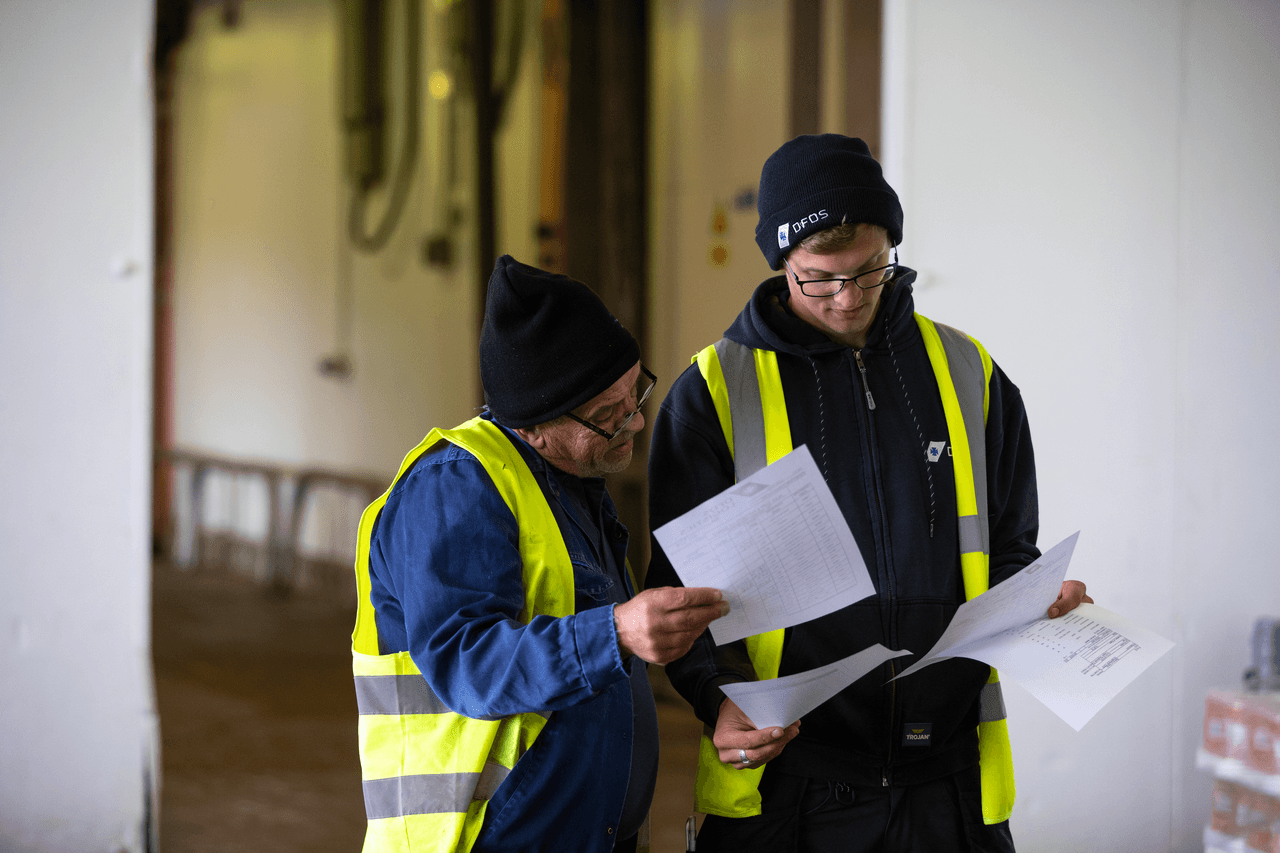 Two DFDS employees reviewing documents at the Larkhall cold chain facility