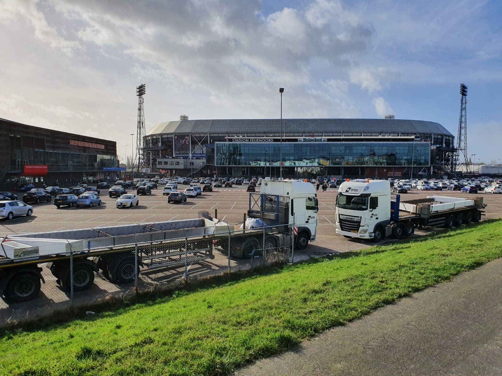 Two DFDS trucks parked outside Feijenoord Stadium, in the Netherlands