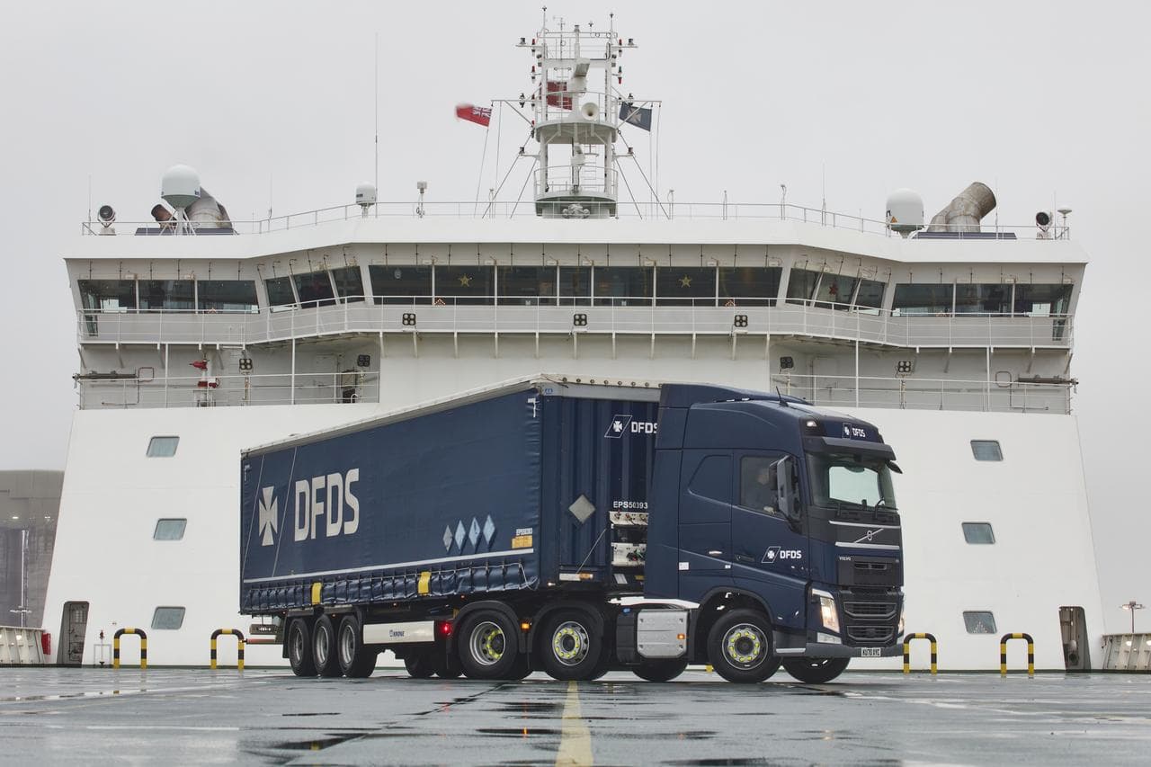 DSDF truck in front of cargo ship